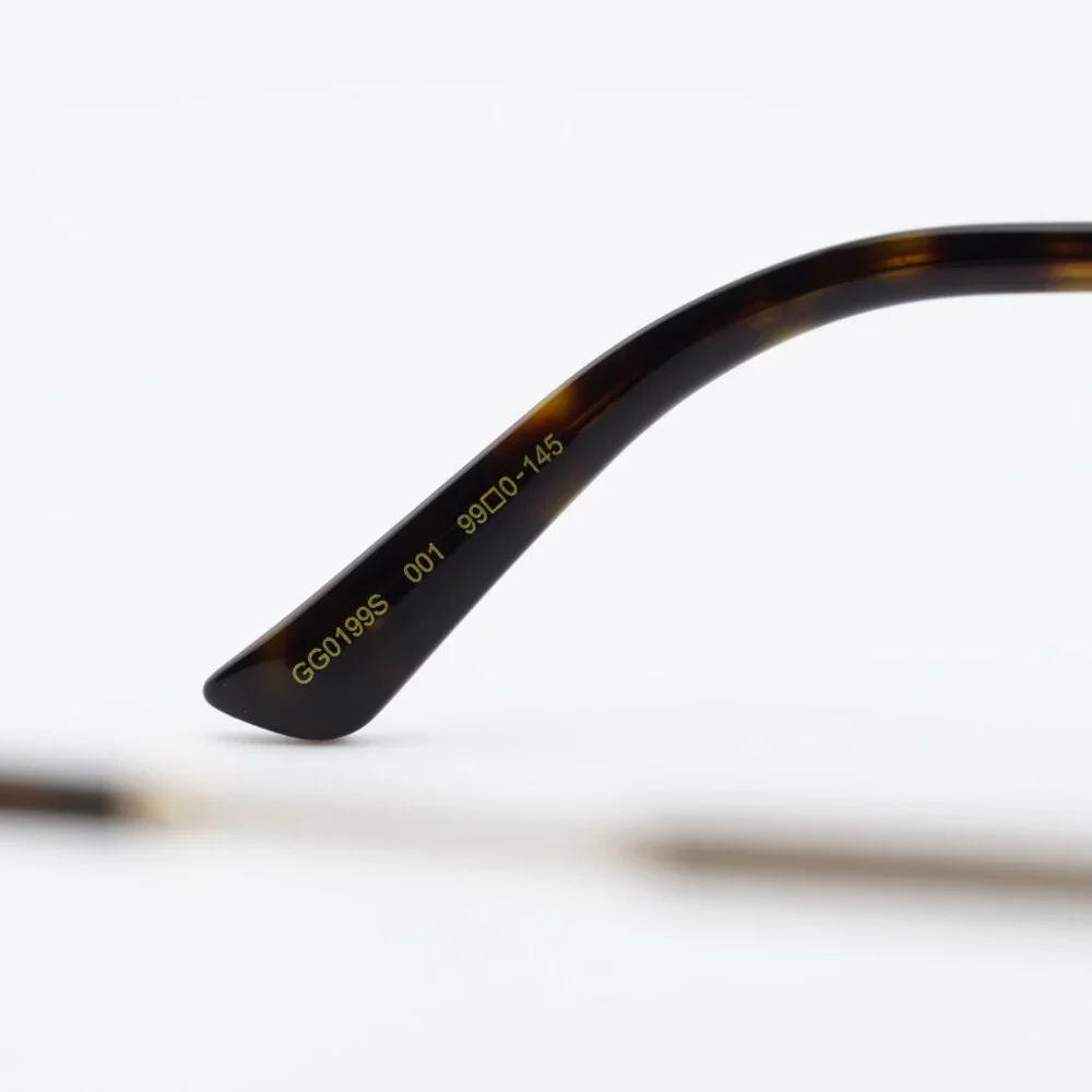 Gucci GG0199S 001 Sunglasses Shiny Black/Gold Shield Frame, Grey Lenses